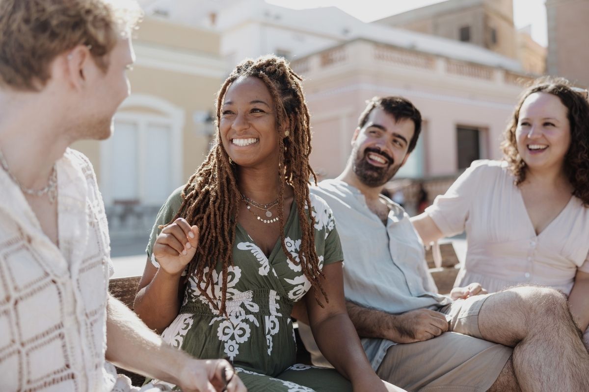 Lakisha and Goldenweeks participants having an engaged outdoor group conversation
